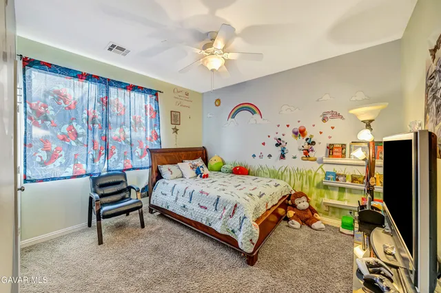 a spacious bathroom with a granite countertop sink and a mirror