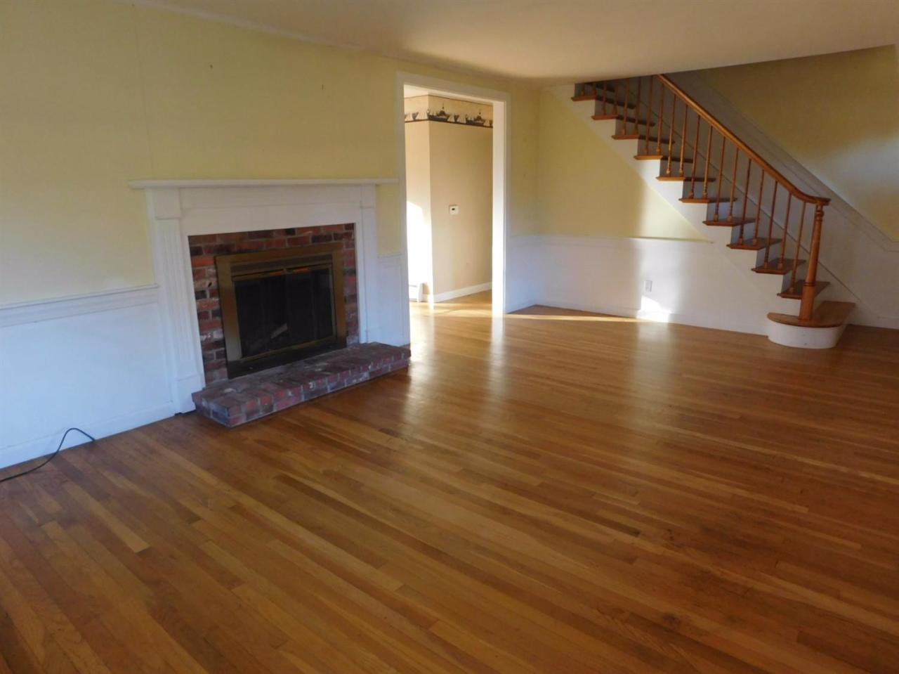 173 Lumbert Mill Road Centerville, MA 02632 - Photo 11 of 17 a view of a livingroom with wooden floor and a fireplace