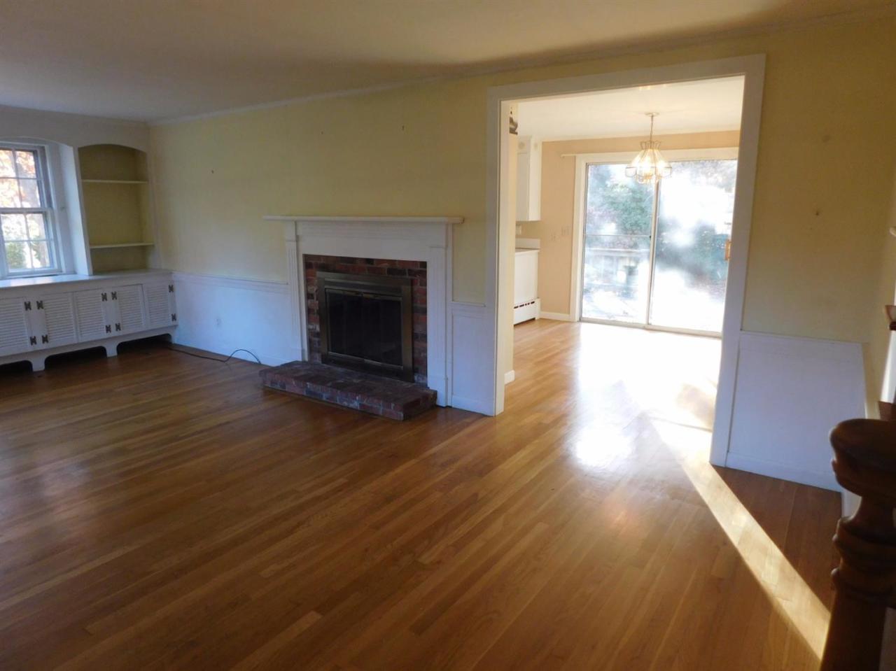 173 Lumbert Mill Road Centerville, MA 02632 - Photo 10 of 17 a view of an empty room with wooden floor and a window