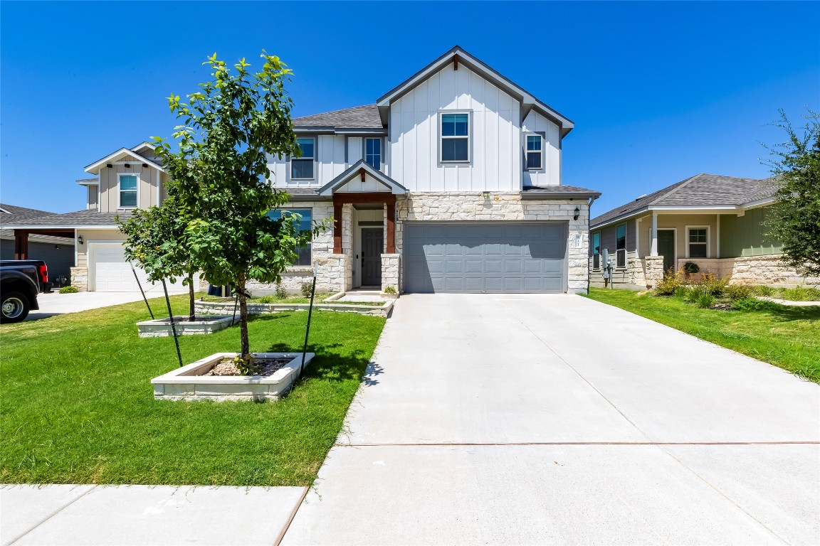 a front view of a house with a yard