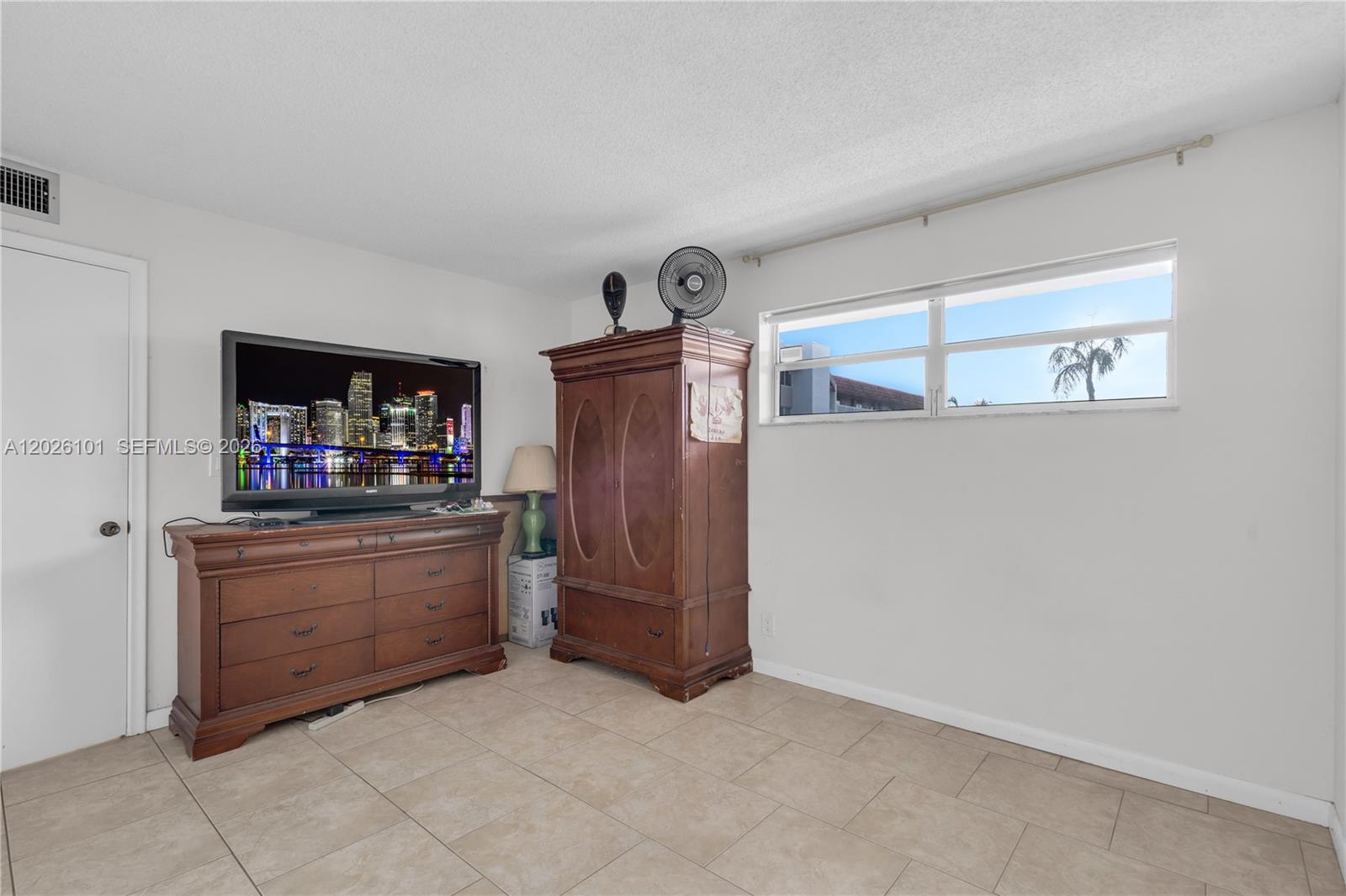 3551 Inverrary Drive, Unit 208 Lauderhill, FL 33319 - Photo 14 of 34 a kitchen with granite countertop a refrigerator and a stove