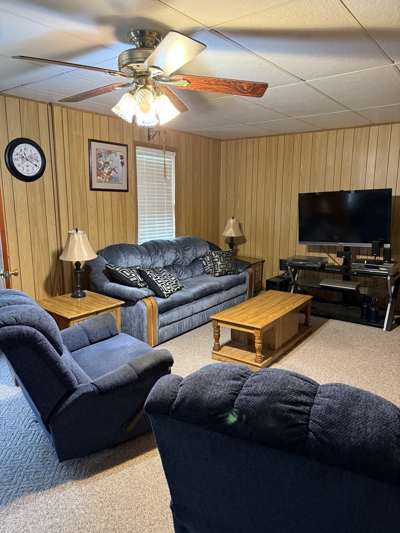 407 Middleton Street Iuka, IL 62849 - Photo 3 of 14 a bedroom with furniture and a flat screen tv