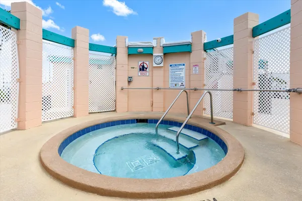 a view of a swimming pool and a chair