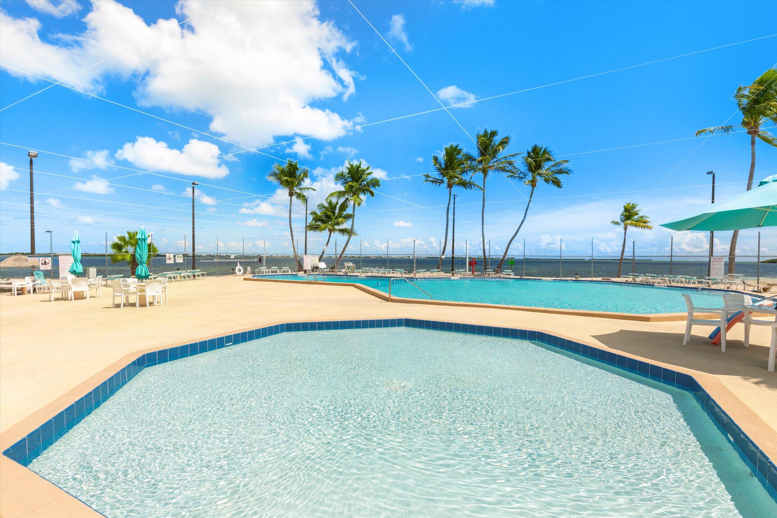 701 Spanish Main Drive, Unit 610 Cudjoe, FL 33042 - Photo 13 of 19 a view of a swimming pool and a chair