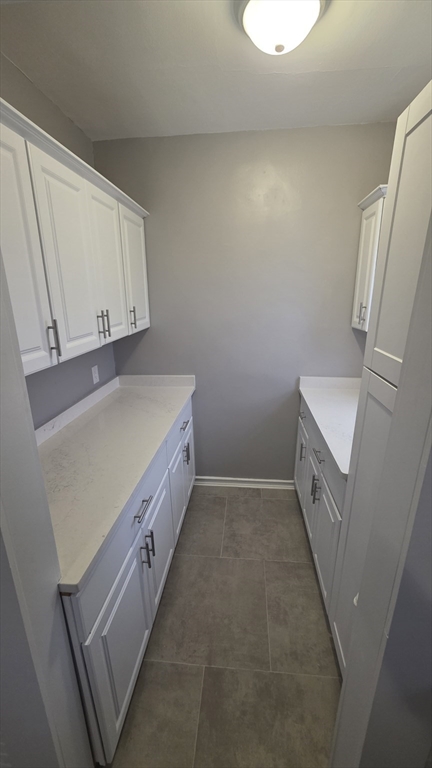 10 Itasca Street, Unit 3 Boston, MA 02126 - Photo 11 of 14 a bathroom with a double vanity sink and a mirror