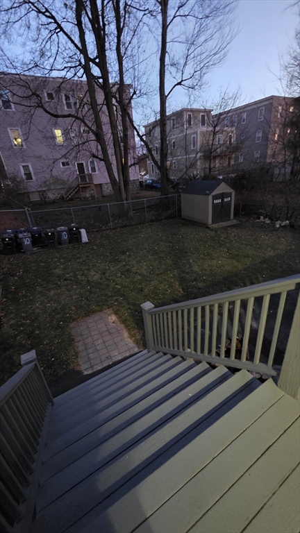 10 Itasca Street, Unit 3 Boston, MA 02126 - Photo 14 of 14 a view of a wooden deck with a bench