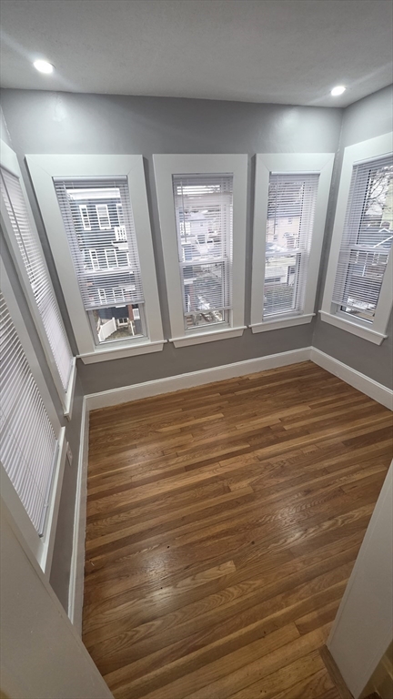10 Itasca Street, Unit 3 Boston, MA 02126 - Photo 5 of 14 a view of an empty room with large windows
