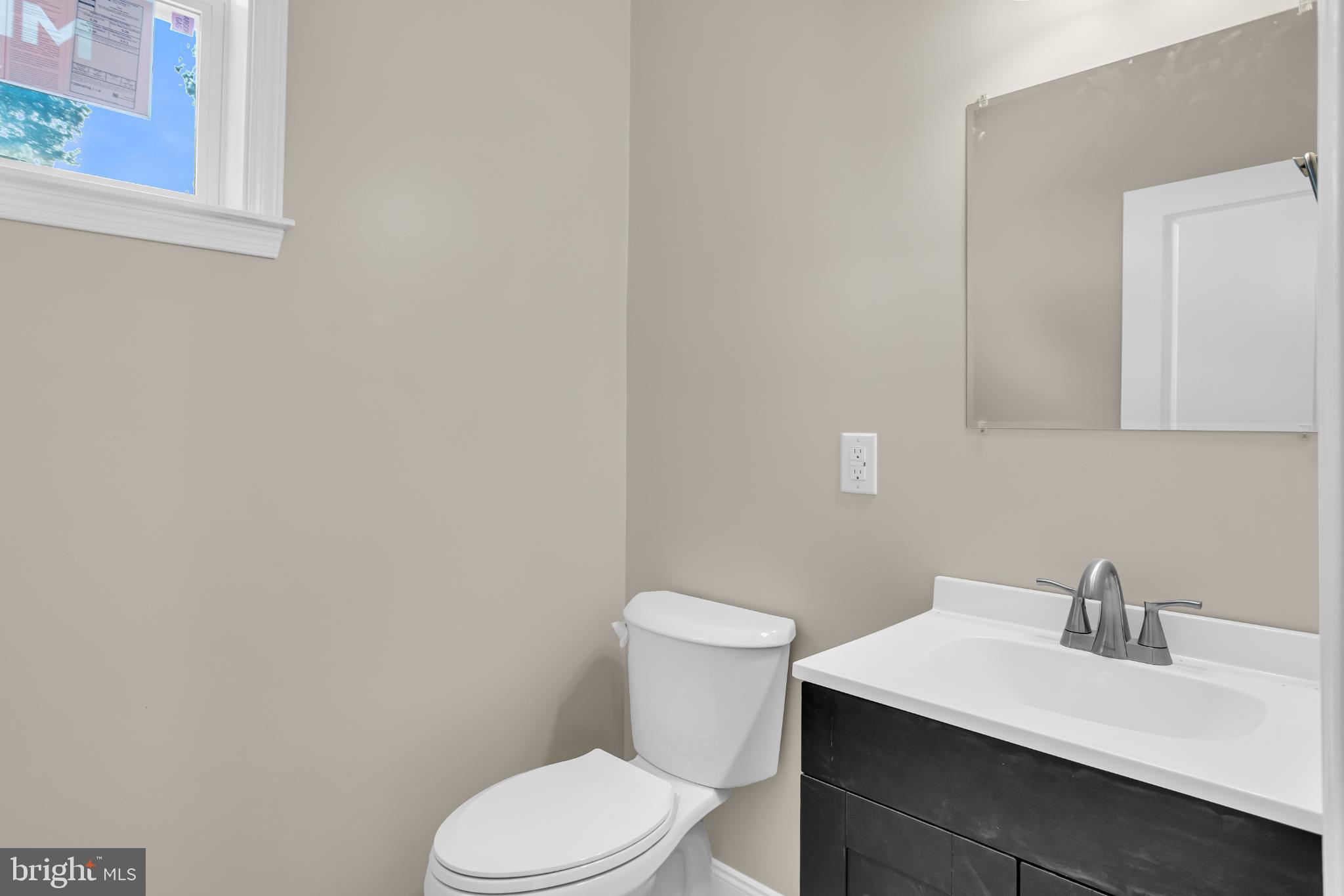 1716 Liggett Avenue Reading, PA 19607 - Photo 15 of 20 a white toilet sitting next to a bathroom sink