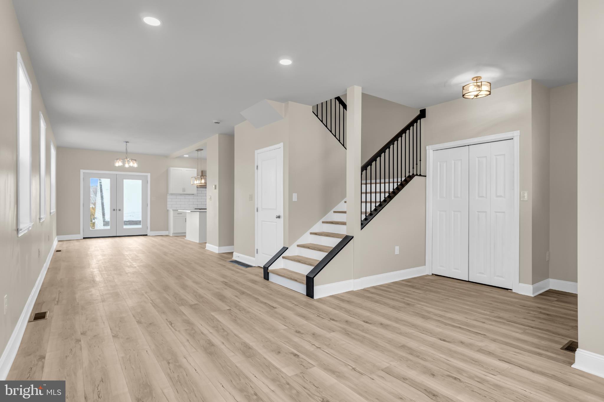 1716 Liggett Avenue Reading, PA 19607 - Photo 9 of 20 a view of an empty room with wooden floor and stairs