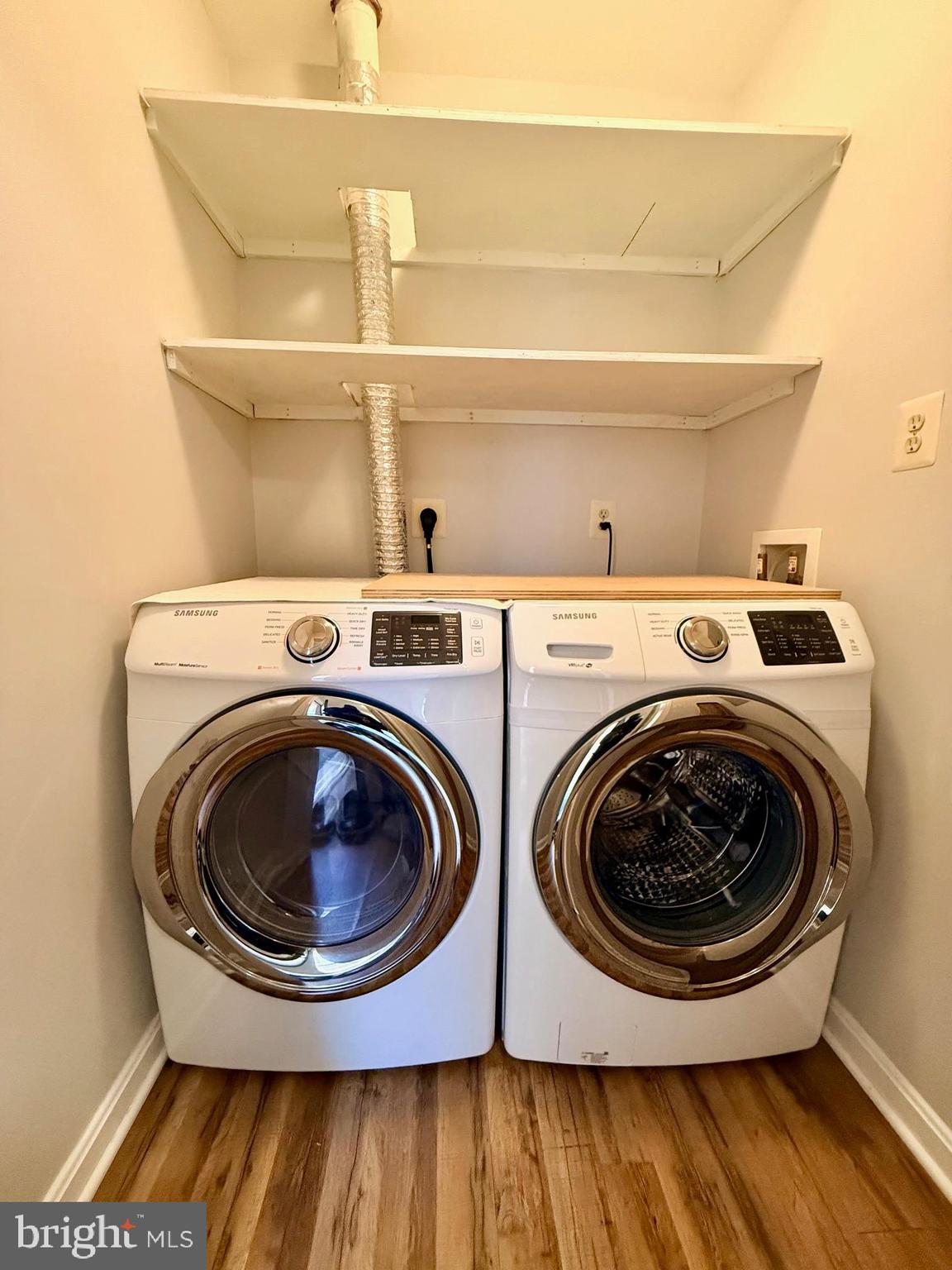 13621 Garfield Place, Unit 102 Woodbridge, VA 22191 - Photo 13 of 14 a utility room with dryer and washer