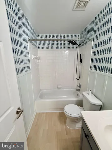 a bathroom with a sink a toilet and a bathtub