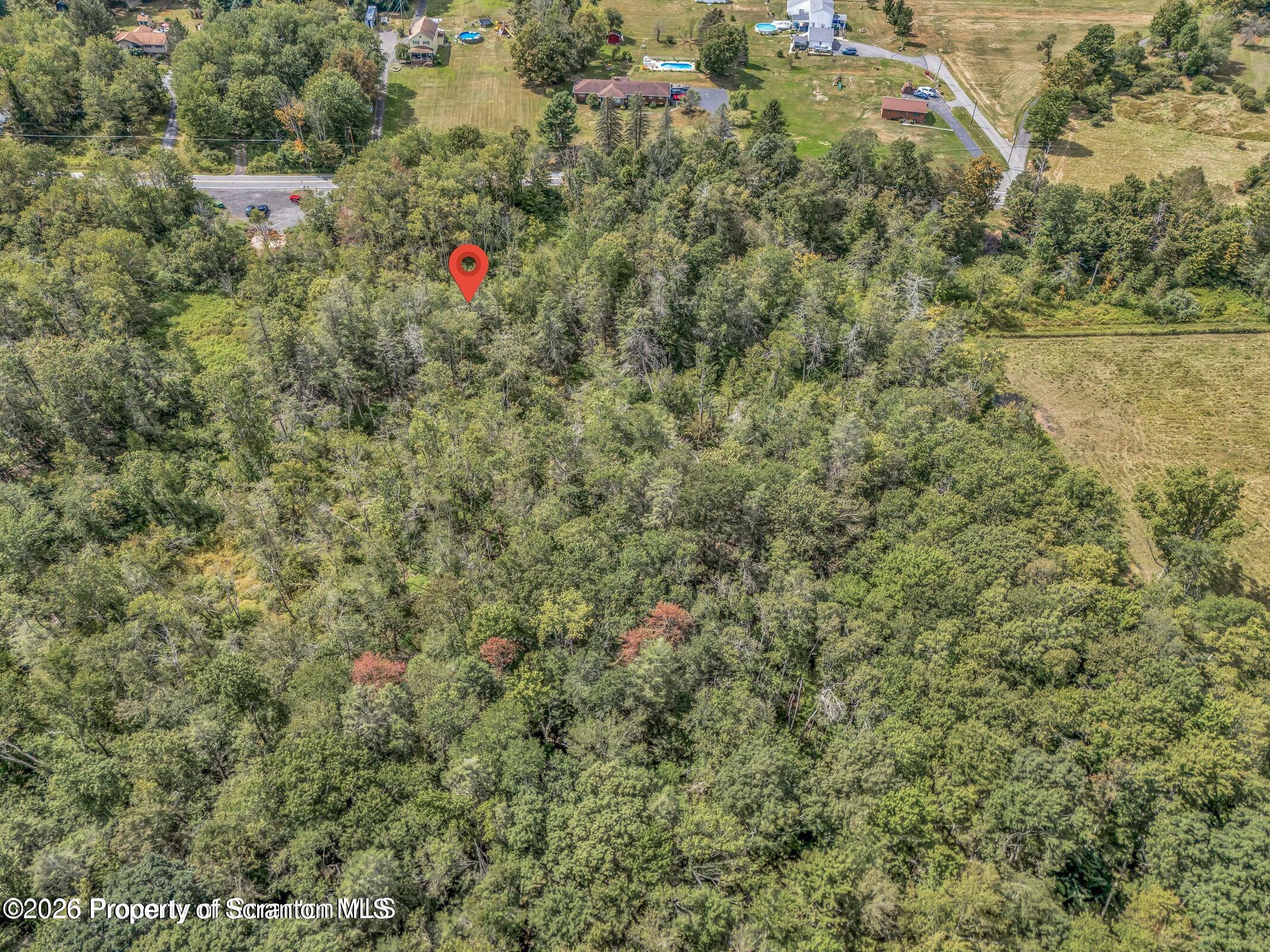 Wesser Rd Spring Brook Moscow, PA 18444 - Photo 6 of 6 an aerial view of residential houses with outdoor space and trees