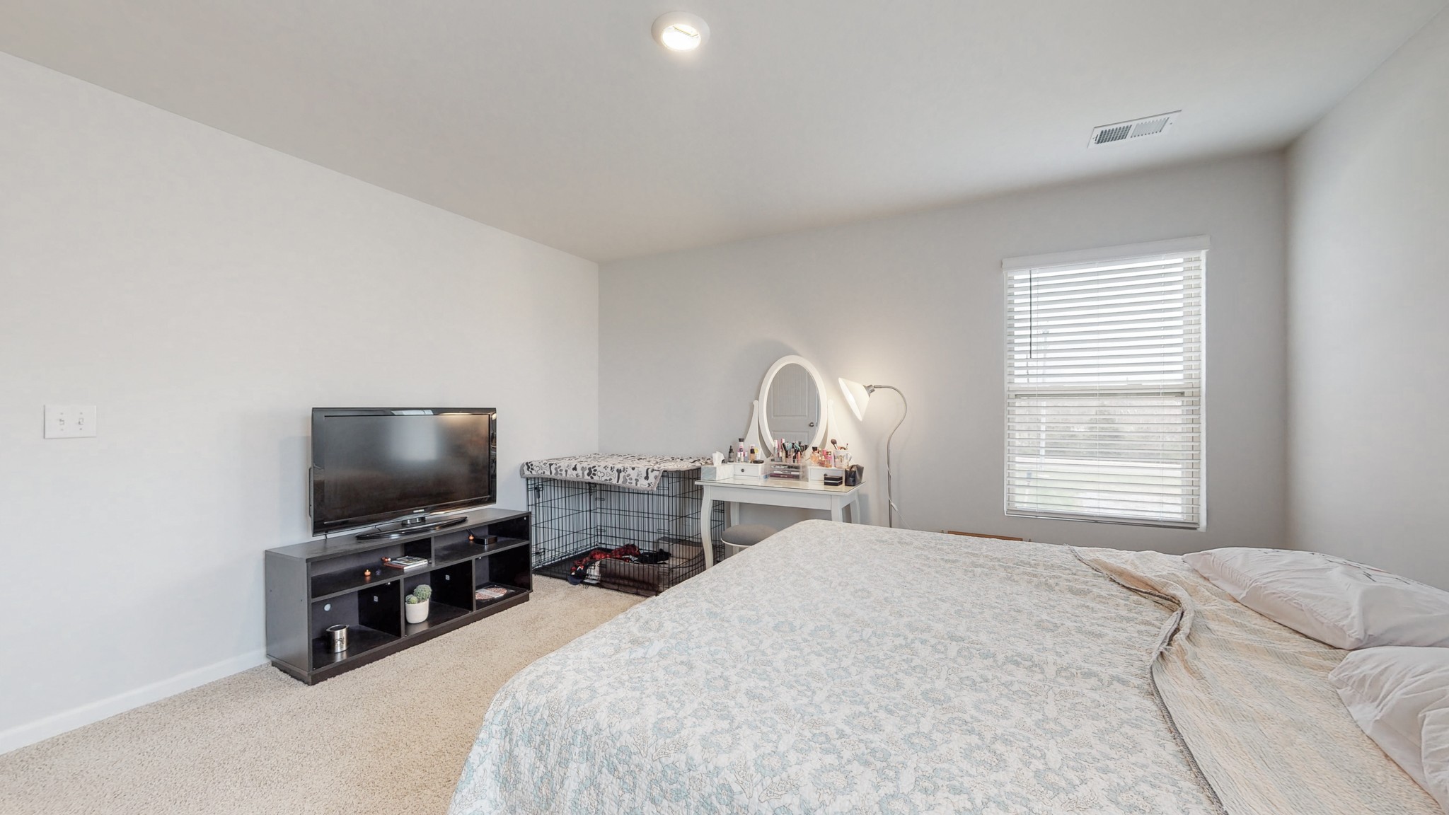 8012 Craighead Drive Lebanon, TN 37087 - Photo 16 of 53 a bedroom with a bed and a flat screen tv