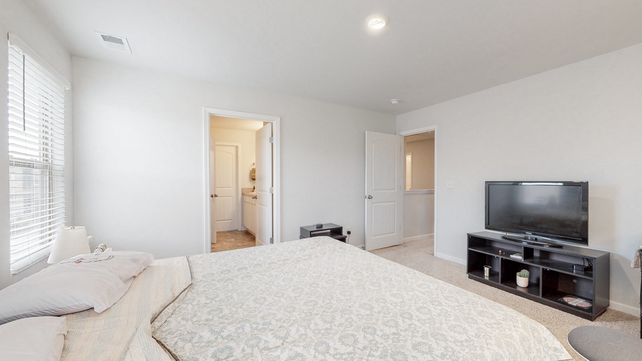 8012 Craighead Drive Lebanon, TN 37087 - Photo 17 of 53 a bedroom with a bed and a flat screen tv