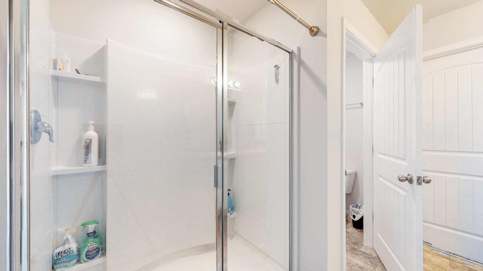 8012 Craighead Drive Lebanon, TN 37087 - Photo 18 of 53 a bathroom with a shower and a glass door