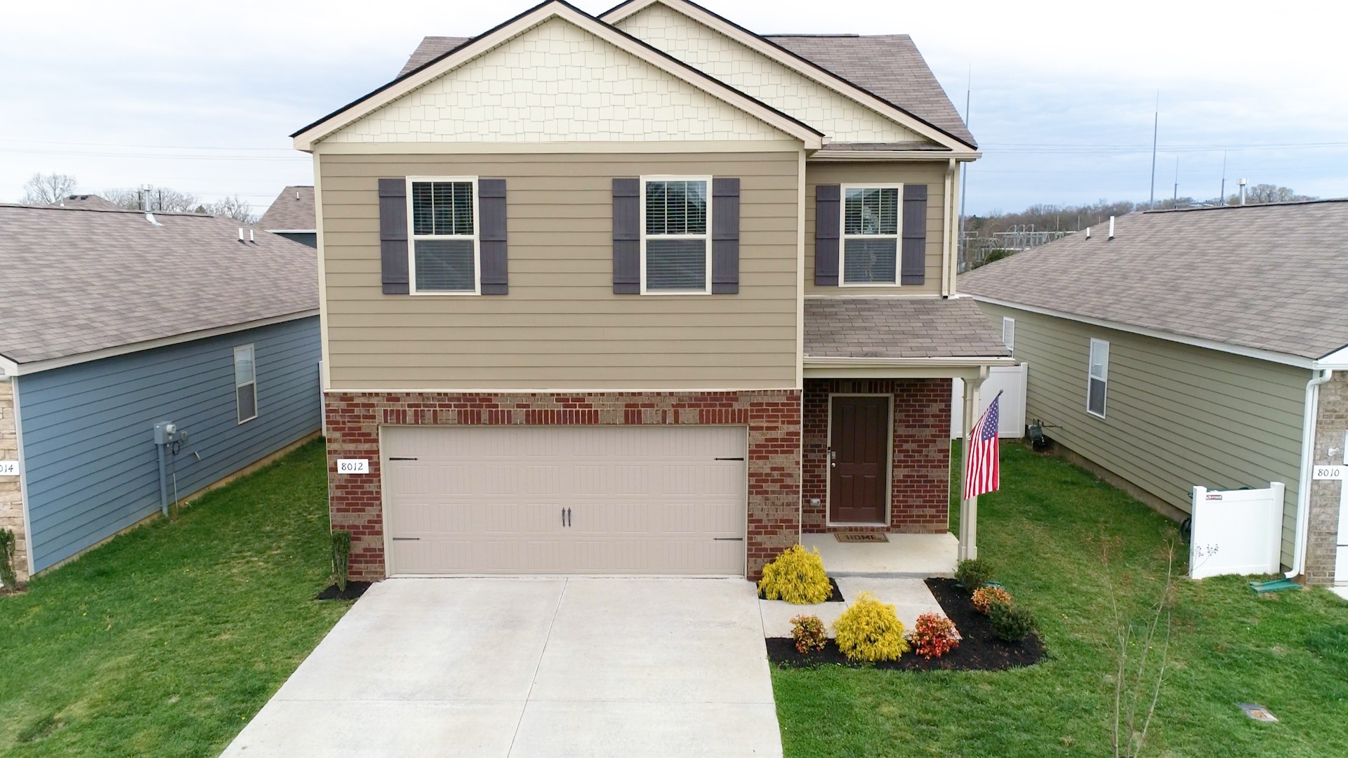 8012 Craighead Drive Lebanon, TN 37087 - Photo 51 of 53 a front view of a house with a garden and plants