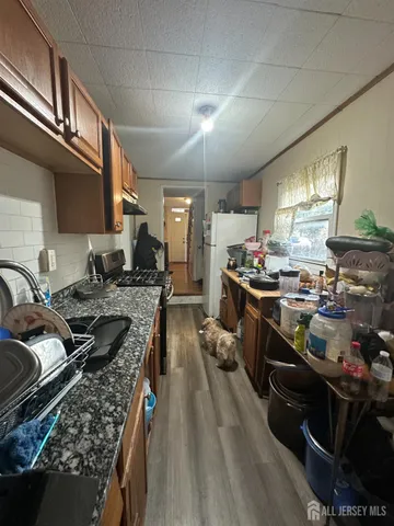 a kitchen with lots of counter top space and stainless steel appliances