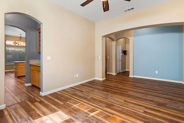a view of a room with wooden floor