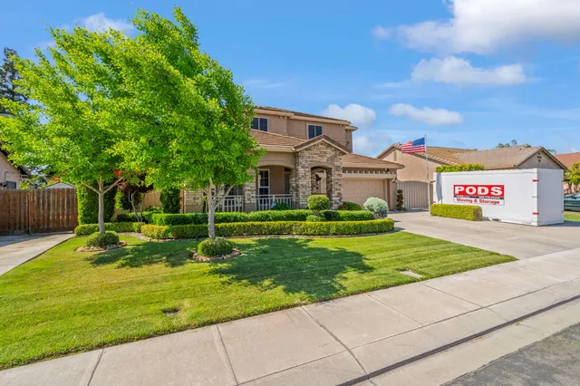 an aerial view of houses with yard