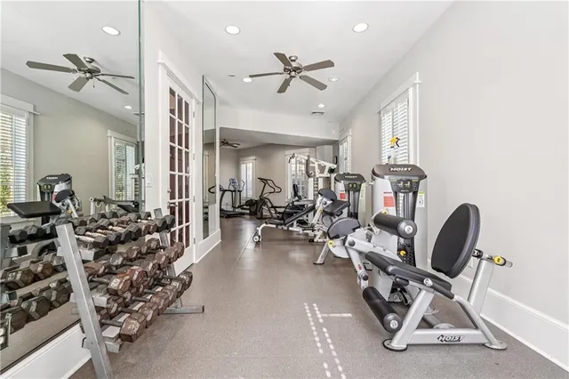 a view of a livingroom with workspace and a window