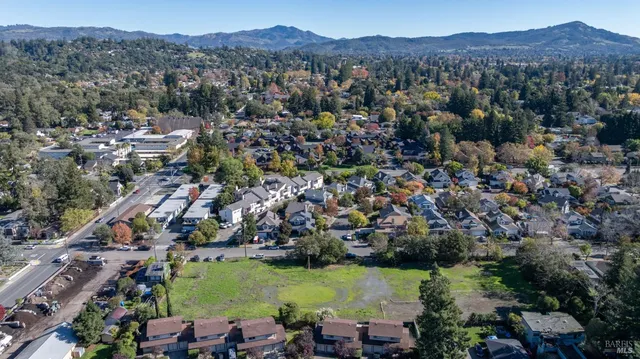 an aerial view of a town with couple of houses