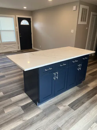 a bathroom with a sink vanity and mirror
