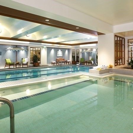 a view of a swimming pool with outdoor seating