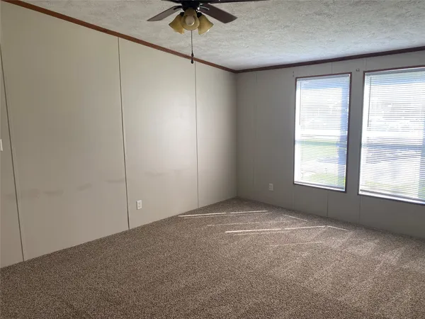 a view of empty room with windows