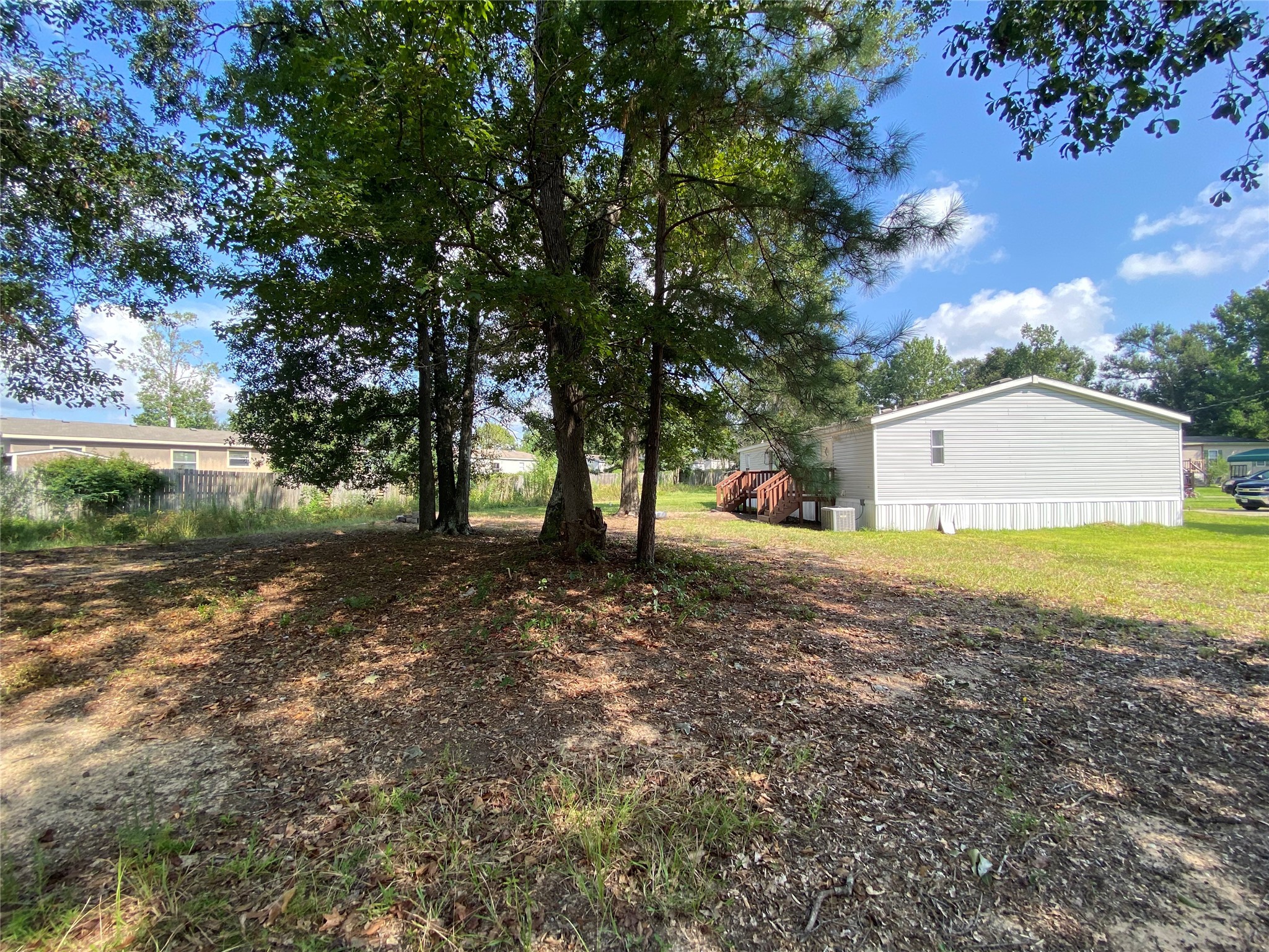 9635 Cedar Ridge Court Willis, TX 77318 - Photo 23 of 25 a view of street with large trees