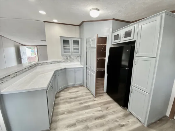 a kitchen with stainless steel appliances a refrigerator and a sink
