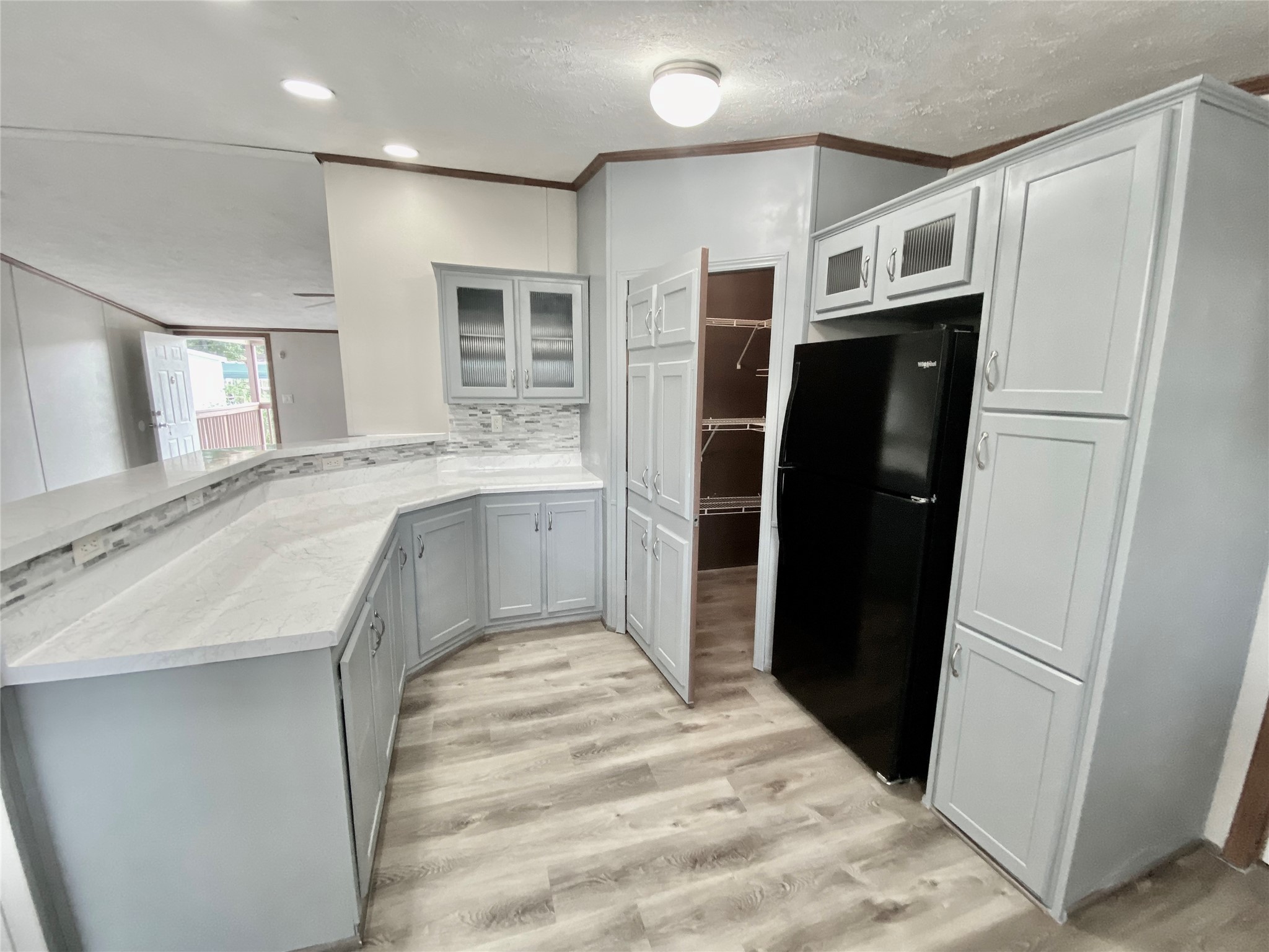 9635 Cedar Ridge Court Willis, TX 77318 - Photo 6 of 25 a kitchen with stainless steel appliances a refrigerator and a sink