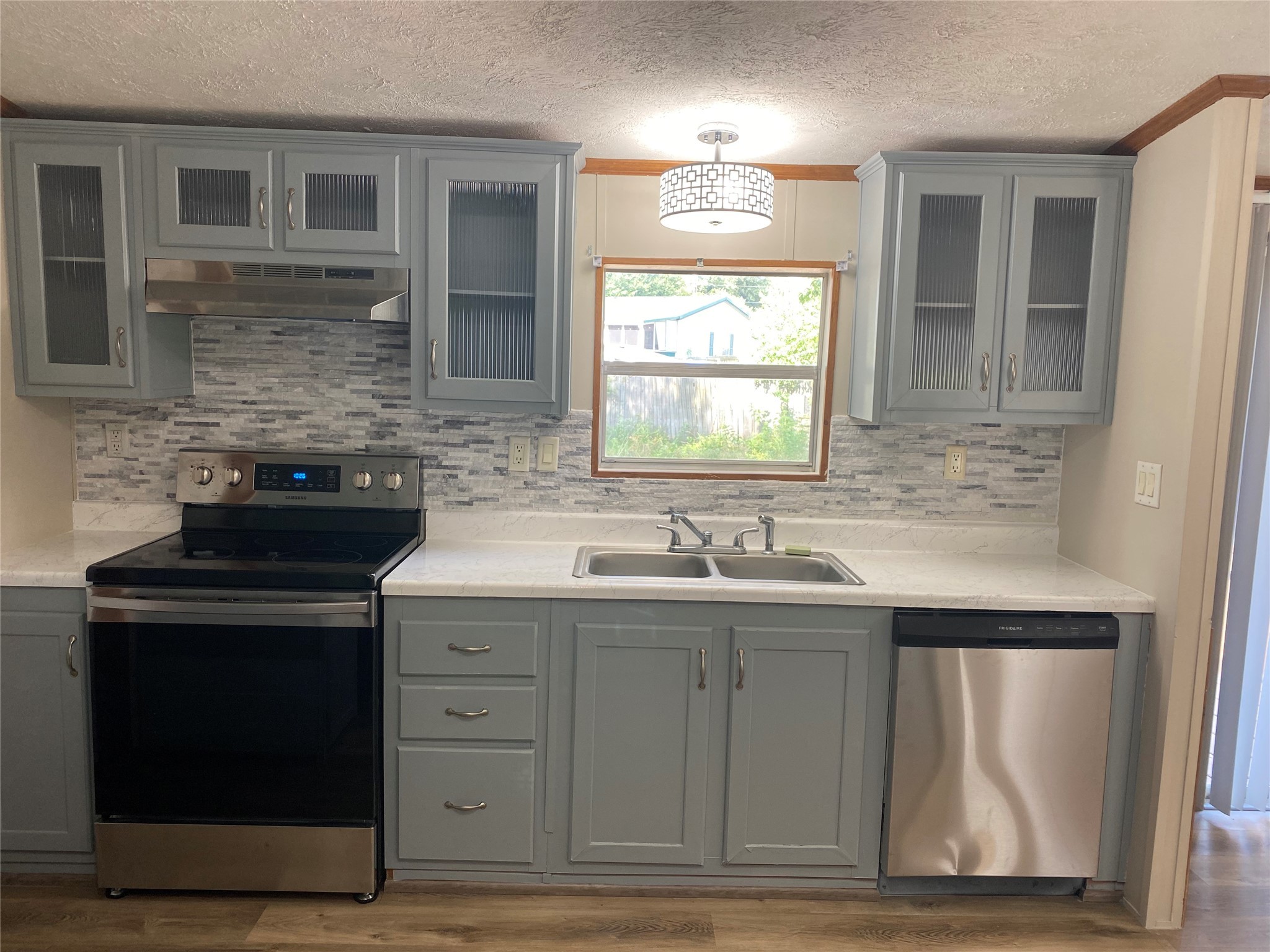 9635 Cedar Ridge Court Willis, TX 77318 - Photo 8 of 25 a kitchen with cabinets appliances and a window