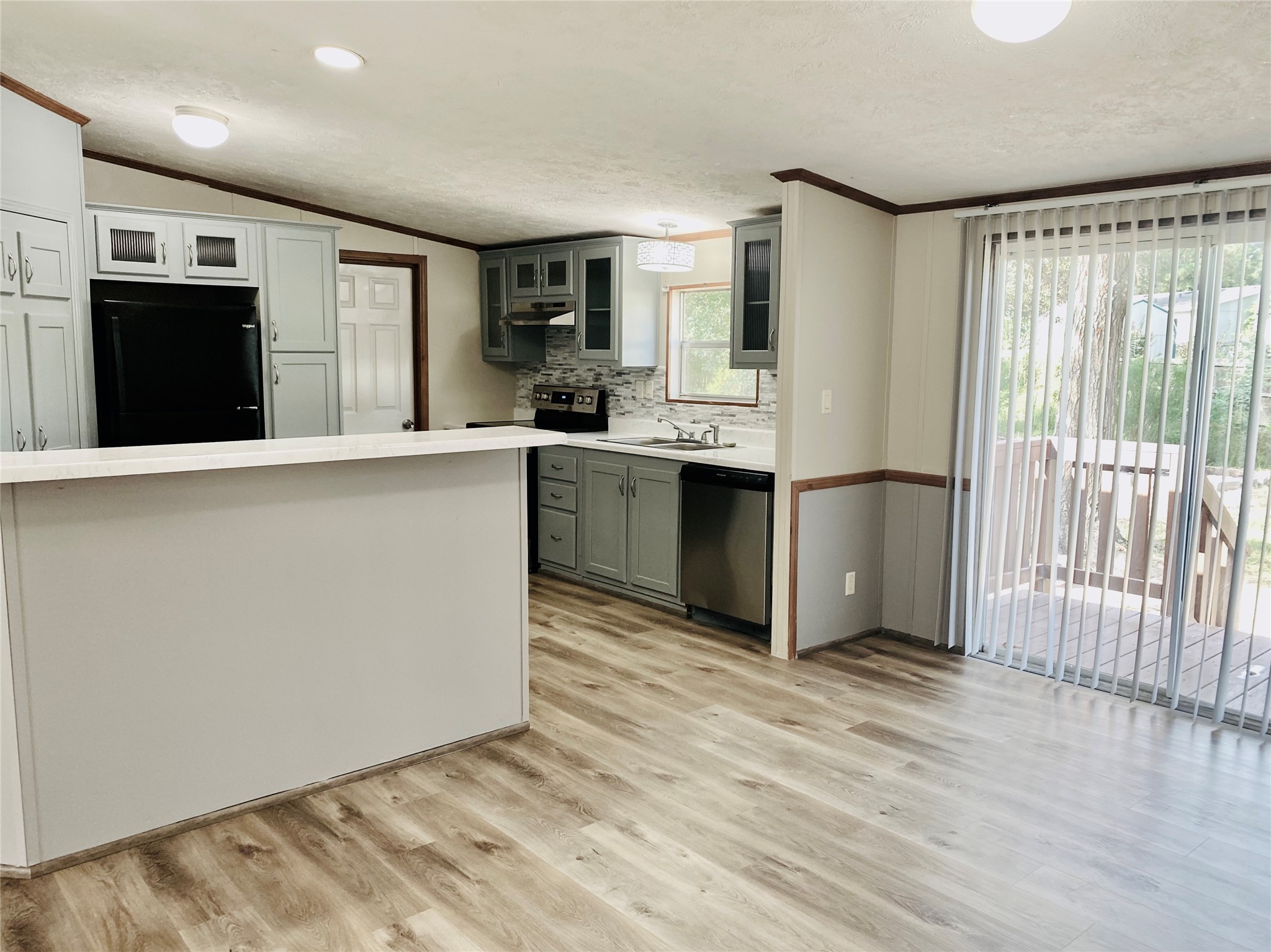 9635 Cedar Ridge Court Willis, TX 77318 - Photo 9 of 25 a kitchen with stainless steel appliances granite countertop a refrigerator and a sink