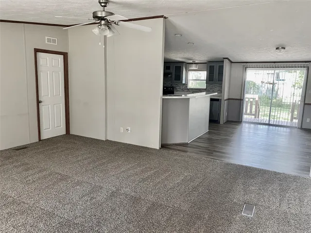 a view of a kitchen with a sink and a kitchen view
