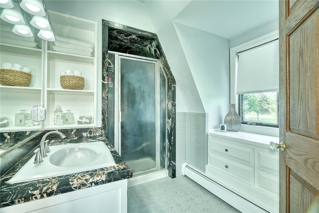 4005 County Line Road Walworth, NY 14502 - Photo 27 of 50 Primary en suite with marbled, vanity and shower.