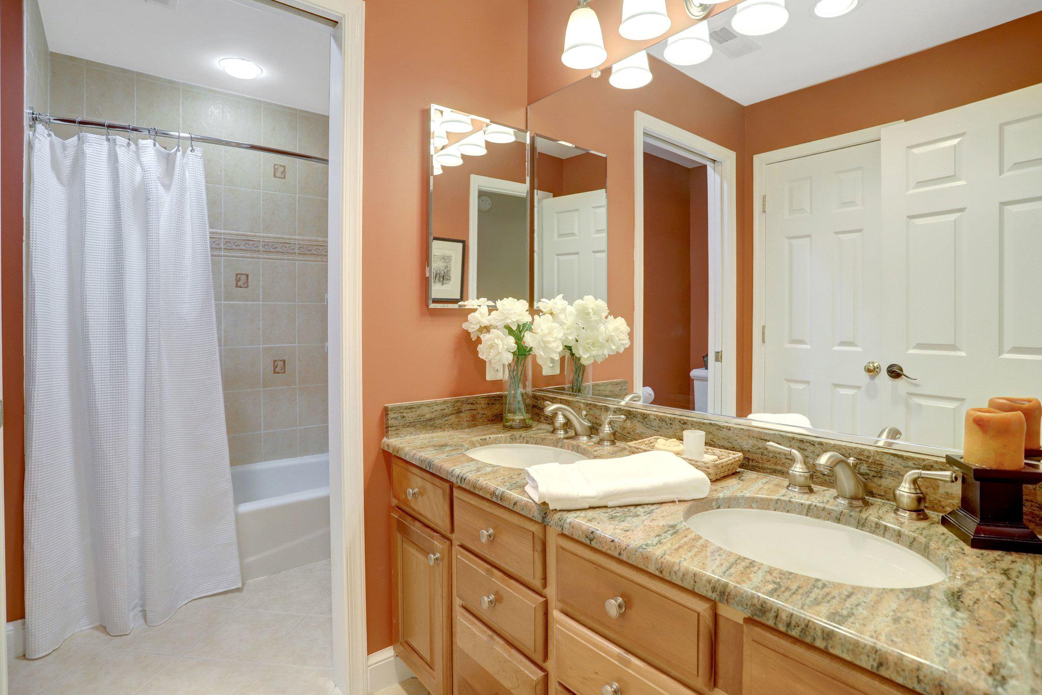 7506 Oriole Avenue Springfield, VA 22150 - Photo 29 of 67 a bathroom with a granite countertop sink and a mirror