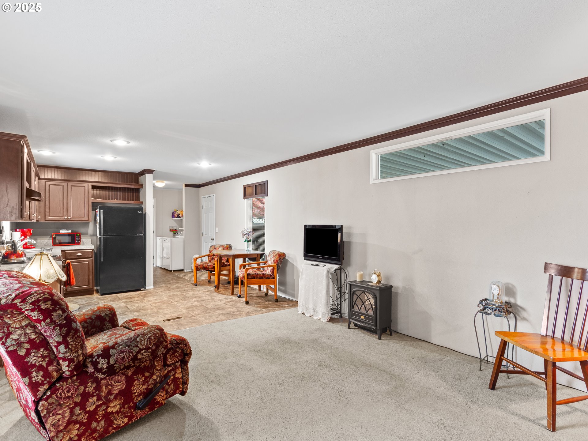 2901 East 2nd Street, Unit 121 Newberg, OR 97132 - Photo 12 of 48 a living room with furniture and a flat screen tv