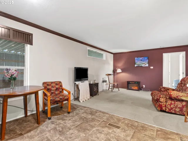 a bedroom with furniture and a flat screen tv