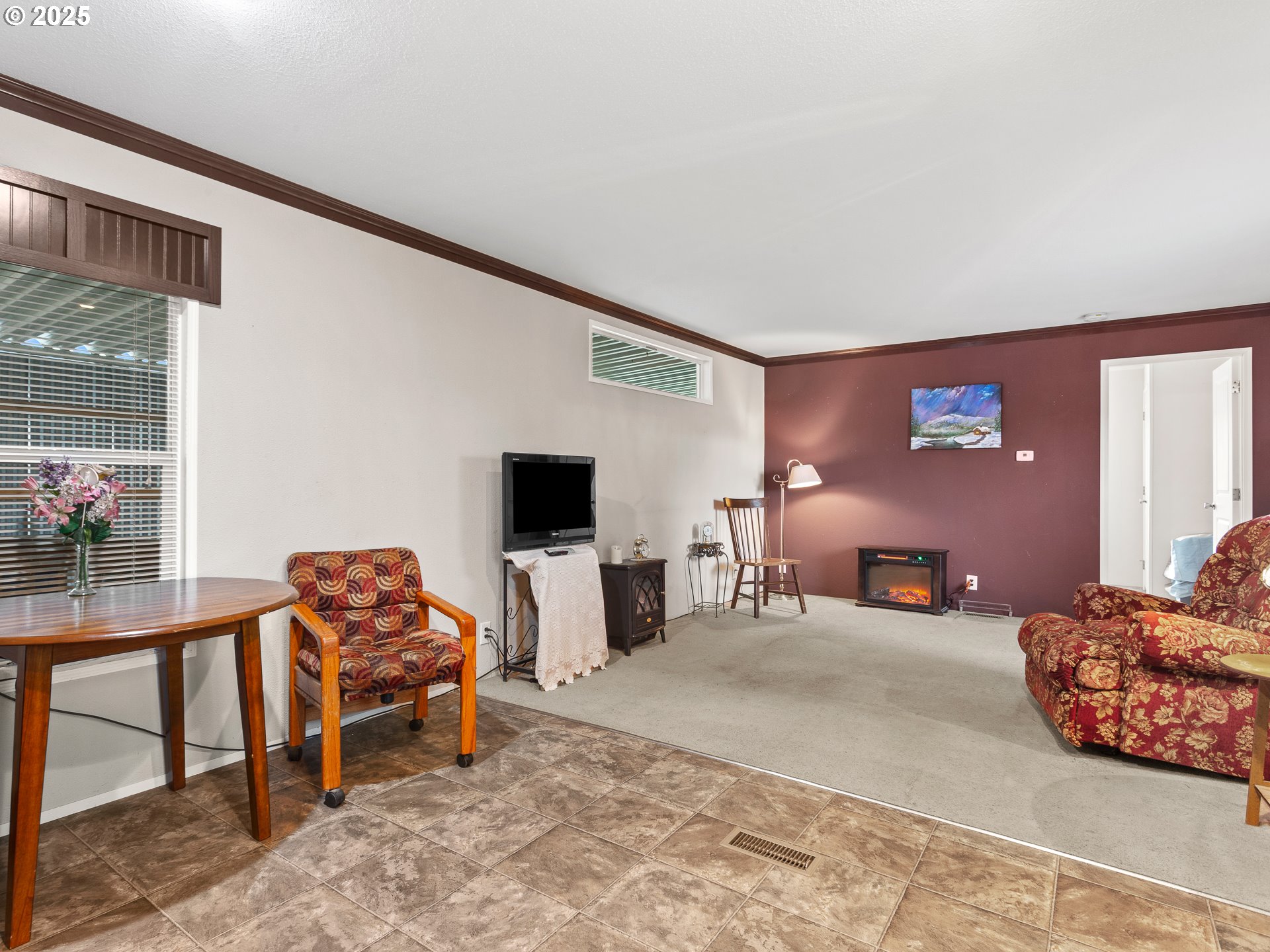 2901 East 2nd Street, Unit 121 Newberg, OR 97132 - Photo 17 of 48 a bedroom with furniture and a flat screen tv