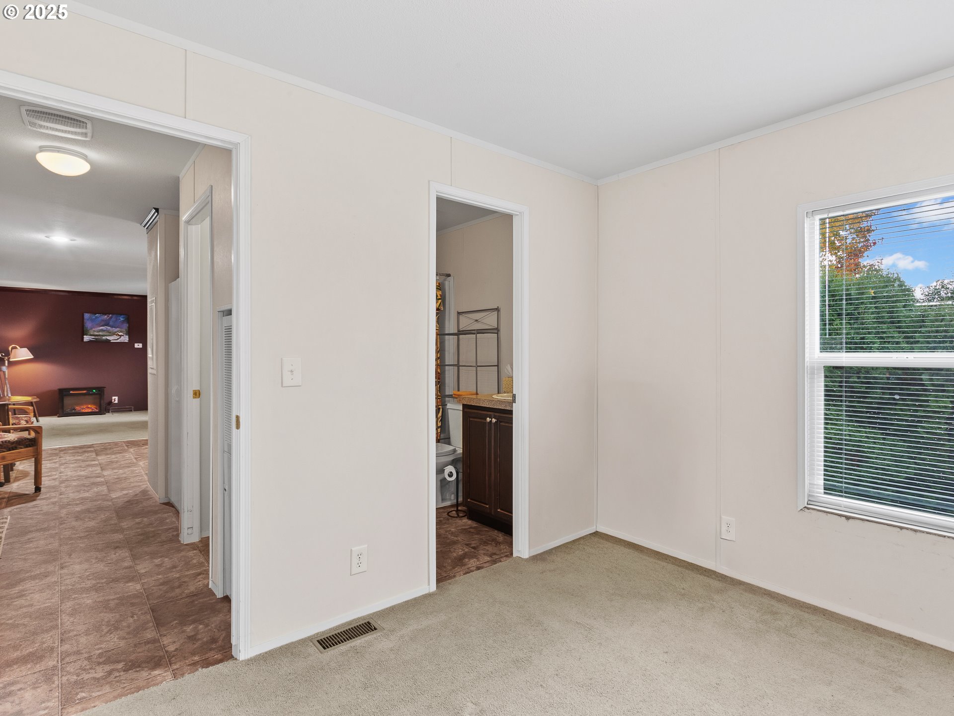 2901 East 2nd Street, Unit 121 Newberg, OR 97132 - Photo 25 of 48 an empty room with windows and entrance
