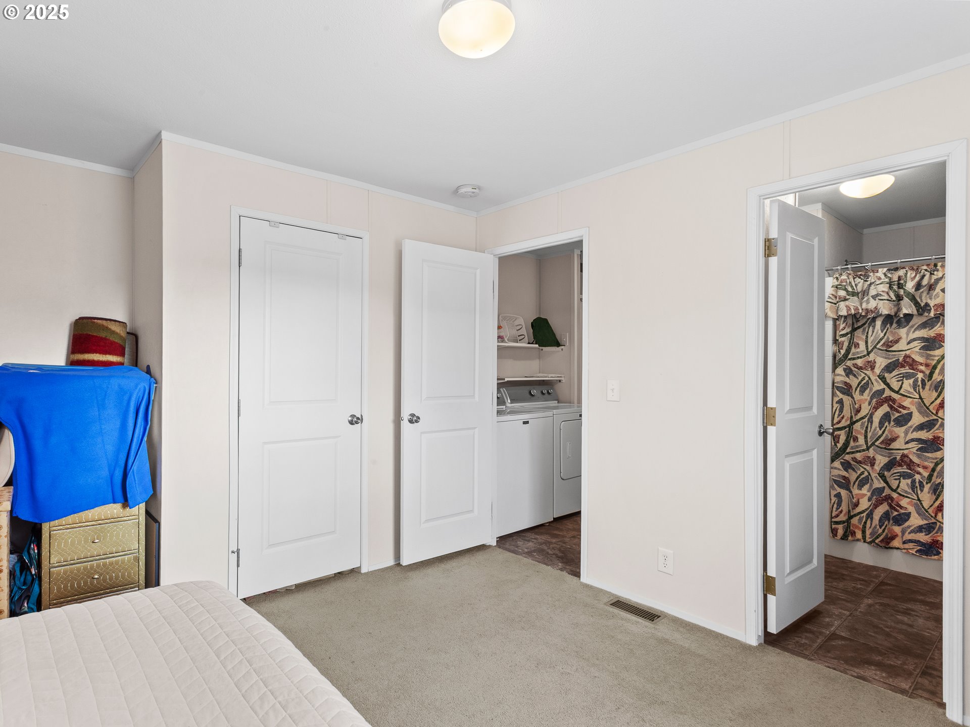 2901 East 2nd Street, Unit 121 Newberg, OR 97132 - Photo 26 of 48 a bedroom with a bed and a couch