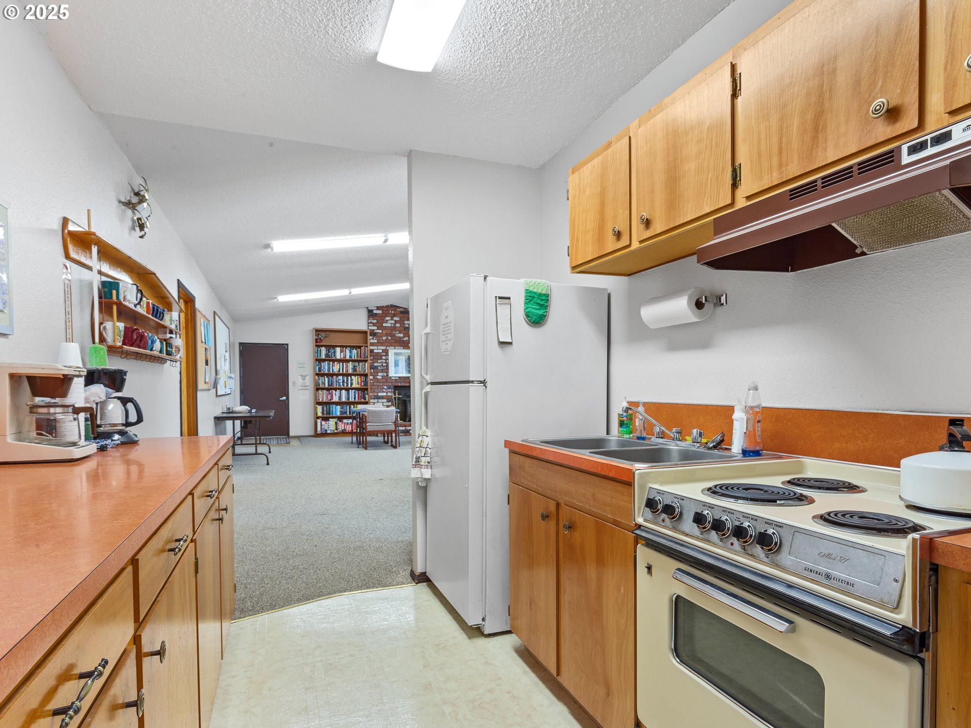 2901 East 2nd Street, Unit 121 Newberg, OR 97132 - Photo 37 of 48 a kitchen with stainless steel appliances granite countertop a stove and a sink