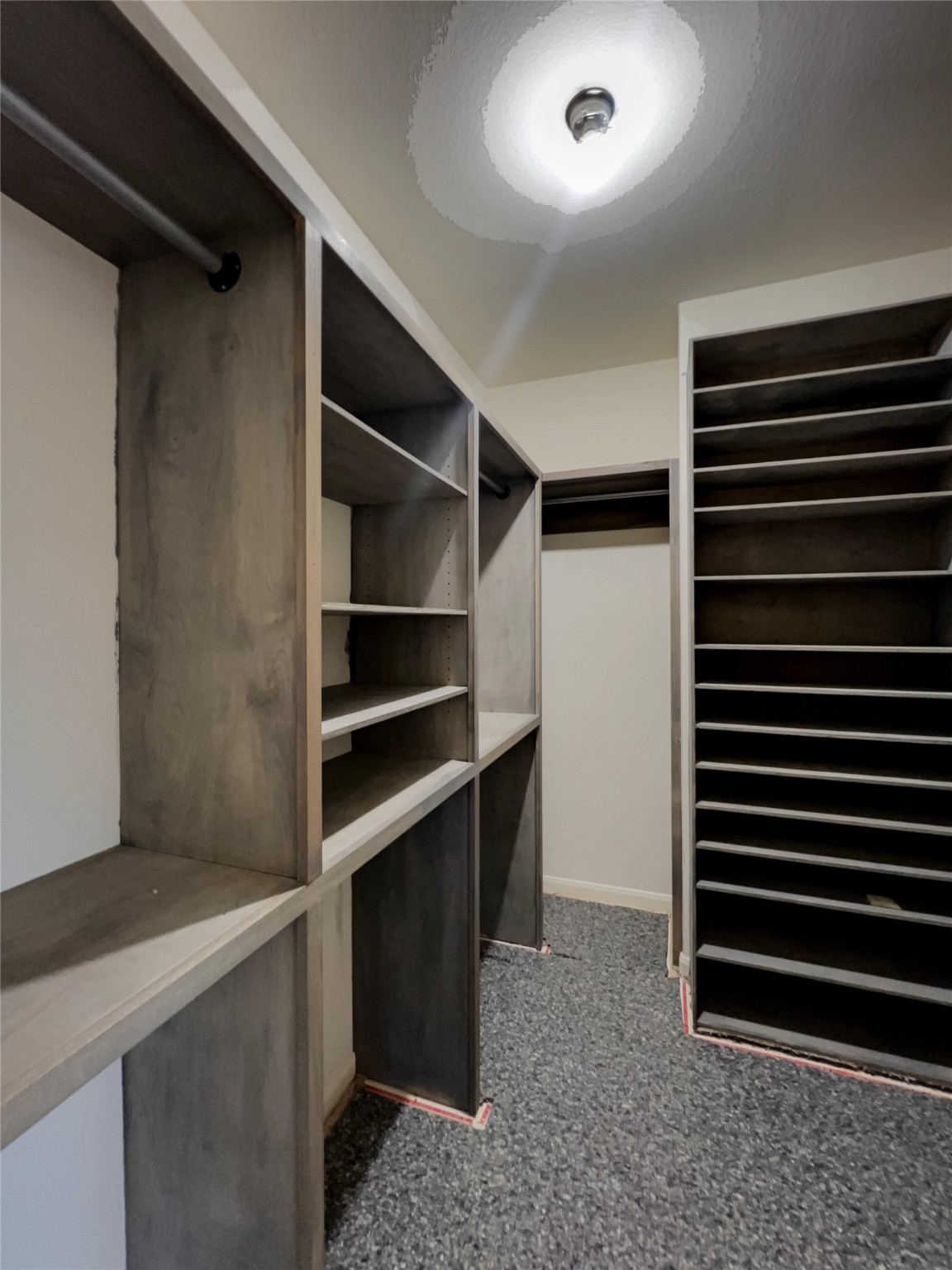 20326 Linshire Drive Spring, TX 77388 - Photo 13 of 24 Primary closet with beautiful built-ins (and brand-new! carpet being installed).