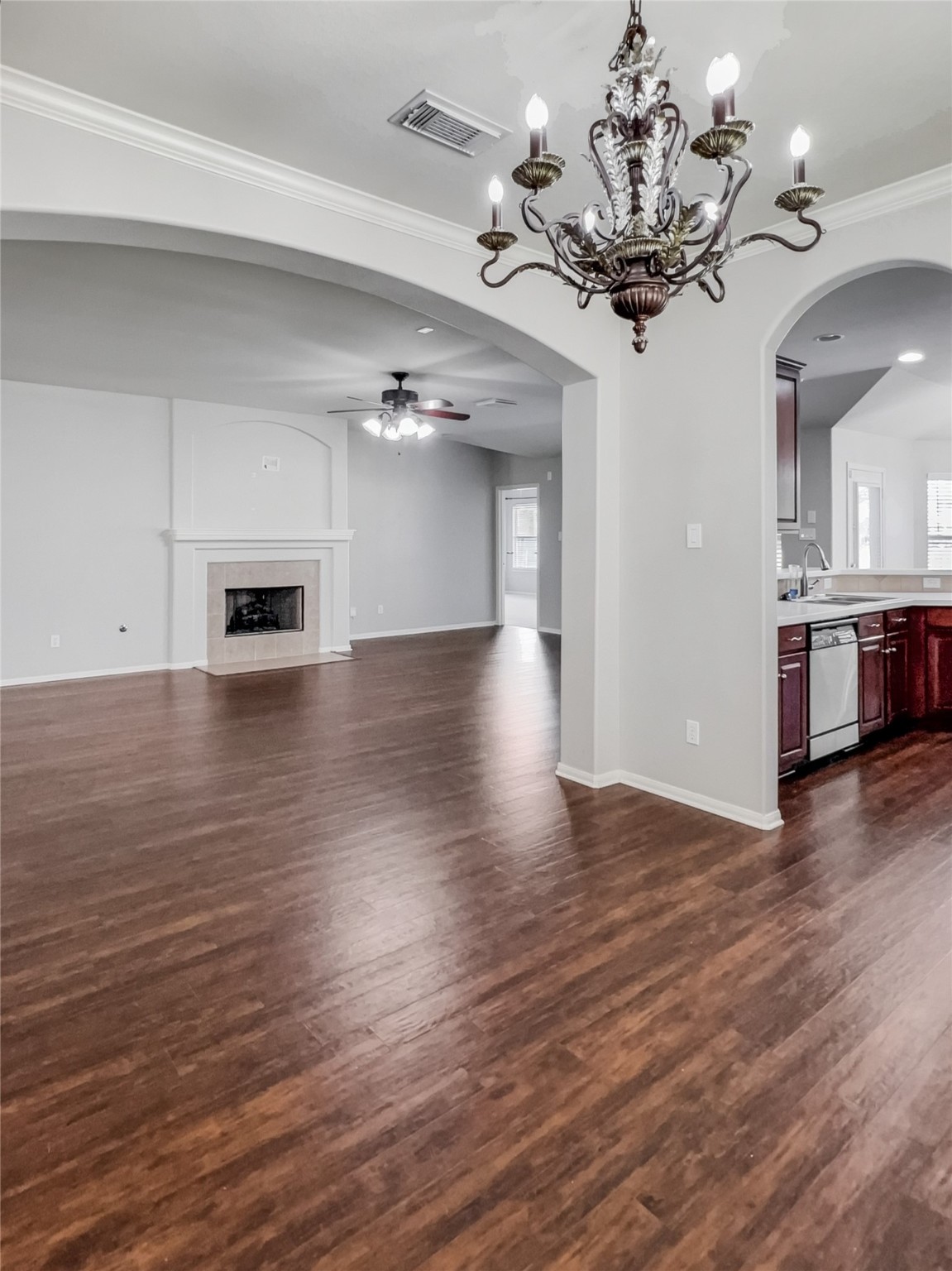 20326 Linshire Drive Spring, TX 77388 - Photo 8 of 24 Arched walls frame this dining area and/or open flex-space that connects to the kitchen and ions to the living room & is anchored by a luxurious chandelier.