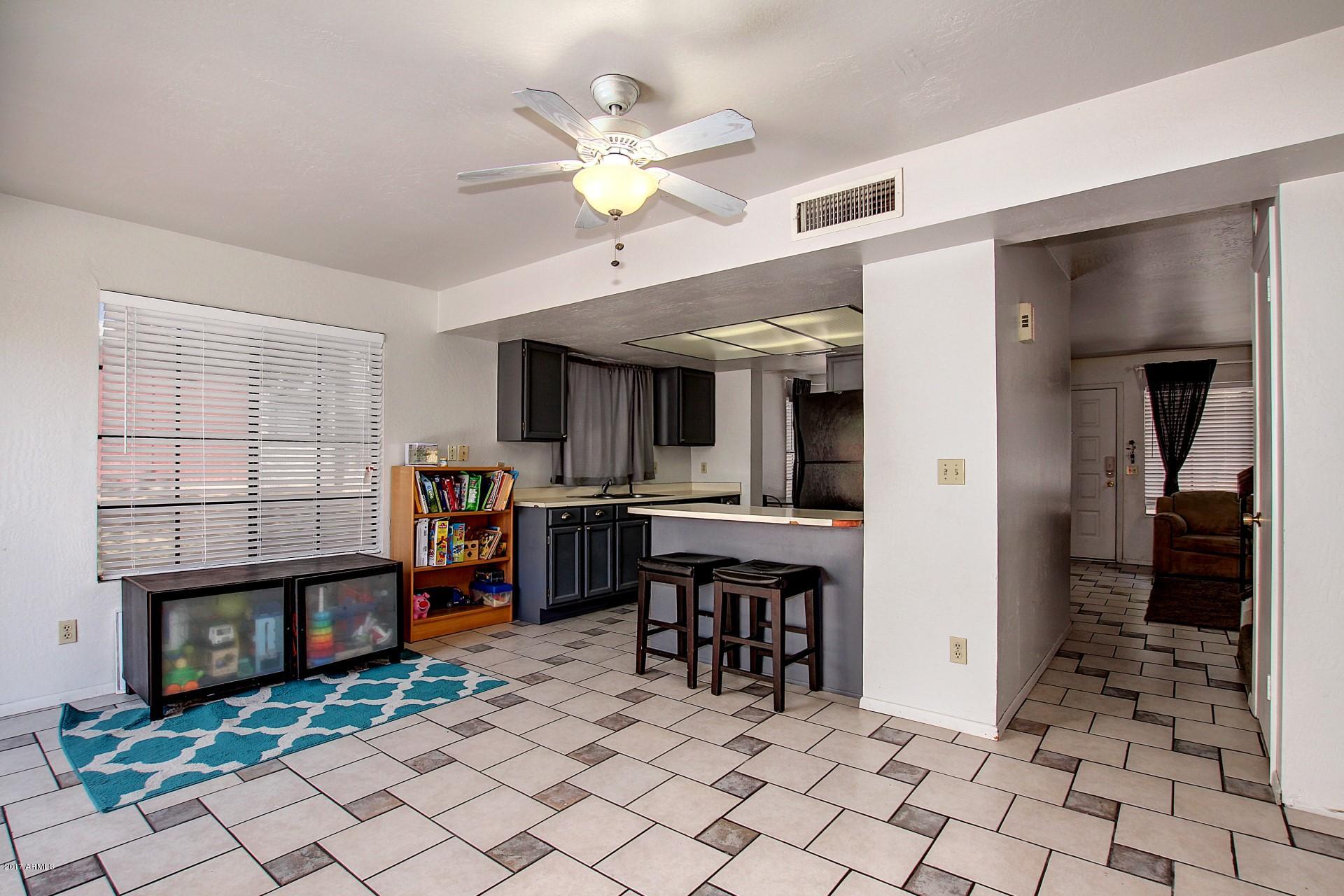 2455 East Broadway Road, Unit 93 Mesa, AZ 85204 - Photo 1 of 26 a view of a livingroom with furniture and a fireplace