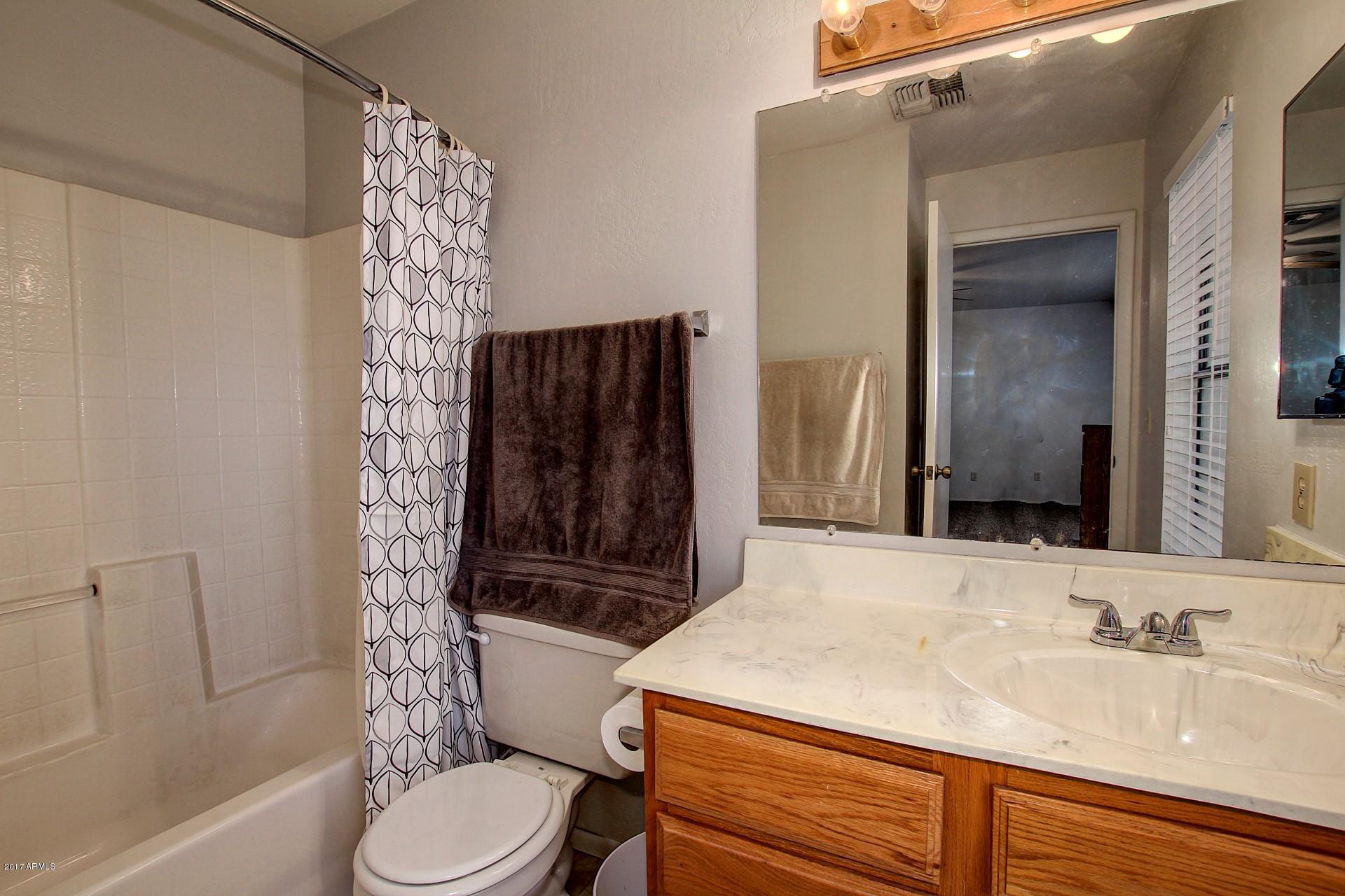 2455 East Broadway Road, Unit 93 Mesa, AZ 85204 - Photo 21 of 26 a bathroom with a sink toilet and shower