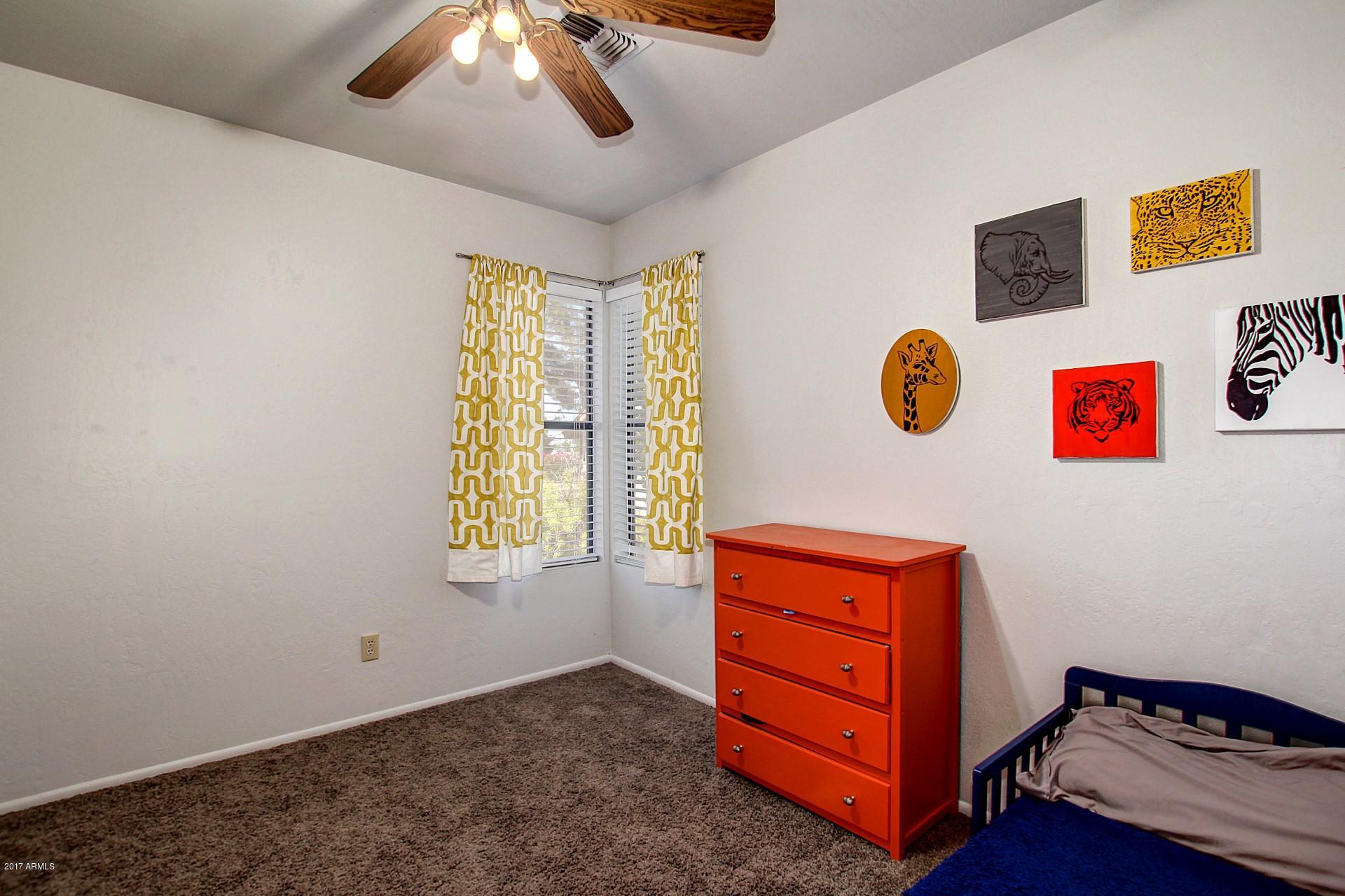 2455 East Broadway Road, Unit 93 Mesa, AZ 85204 - Photo 22 of 26 a view of an empty room with a window