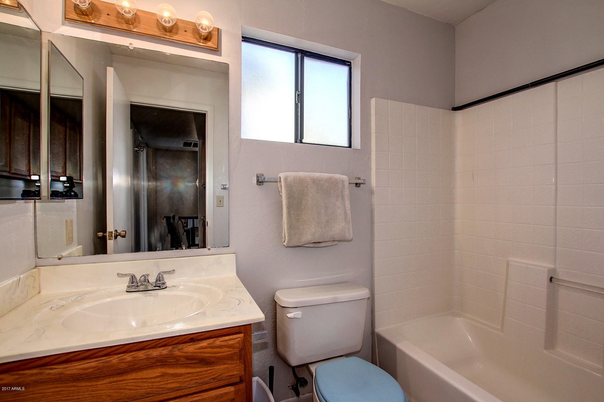 2455 East Broadway Road, Unit 93 Mesa, AZ 85204 - Photo 23 of 26 a bathroom with a sink toilet and shower