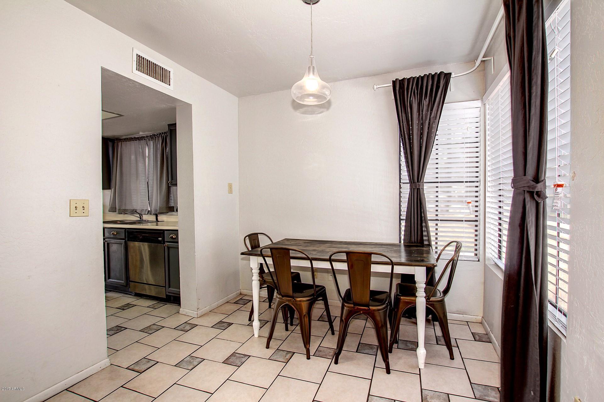 2455 East Broadway Road, Unit 93 Mesa, AZ 85204 - Photo 6 of 26 a view of a dining room with furniture and window