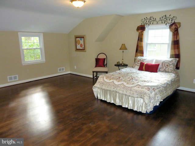 6521 Banbury Road Baltimore, MD 21239 - Photo 16 of 29 a bedroom with a bed and window